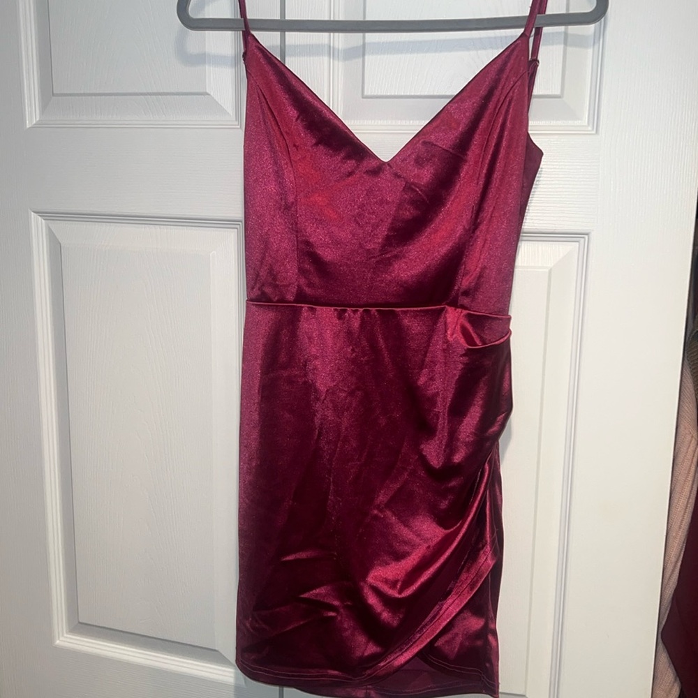 Short satin magenta dress. Size Large. Open back with crossed back. Worn once.